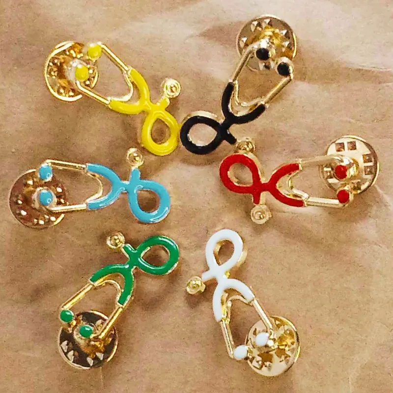 Display of Stethoscope Enamel Pins