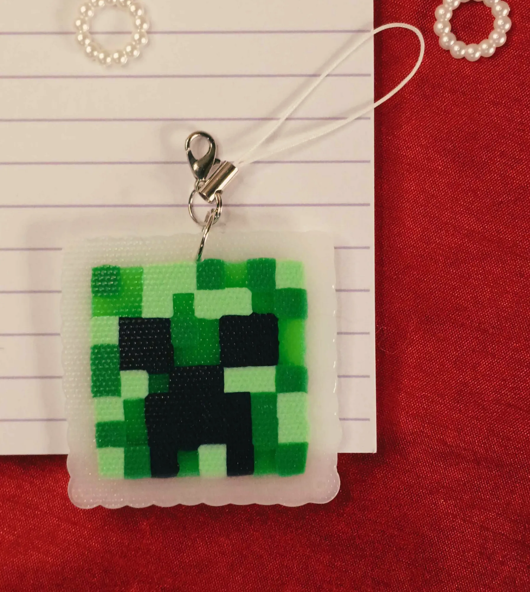 Display of Handcrafted Gaming Icon Phone & Bag Charm